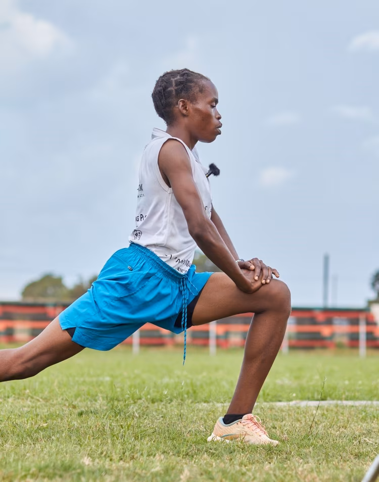 Elizabeth, a longtime resident of Solwezi, is a tailor in the market, a mother, and a wife. She also happens to be the holder of the national women's marathon record and one of Zambia's best endurance runners. (Image by Justine Kunda for Nkwazi Magazine).