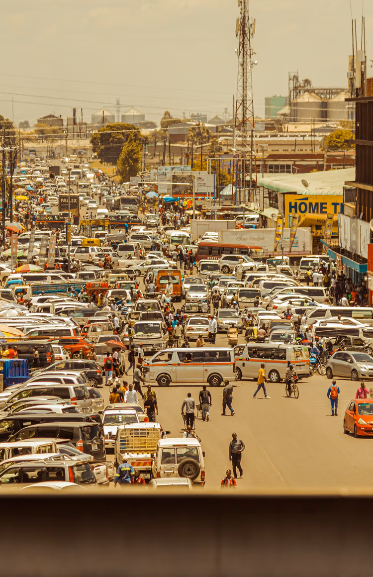 Buses join the hive with an orchestra of hooters trying to make their way through. (Image by Andrew Mutuma).