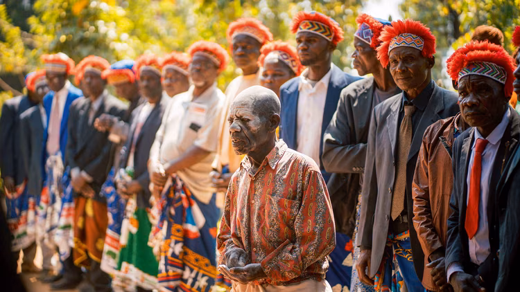 Chiefs, headmen, and visitors present Mwata Kazembe with gifts, beginning with beer, goats, grain, and foodstuffs, which will form part of the feasting. (Image by Chona Mweemba for Nkwazi Magazine).
