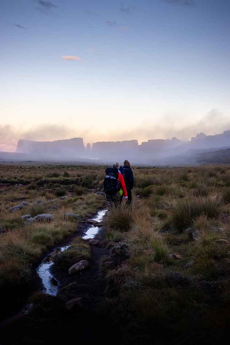 Hikers trek through the early morning mist. (Image by Lenka Znamenackova).