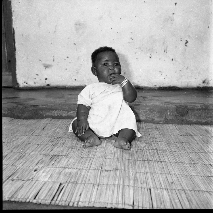 He photographed families and friends within their homes or streets, sometimes capturing candid moments. (Image by Alick Phiri courtesy of Everday Lusaka Gallery and Zambia Belonging).