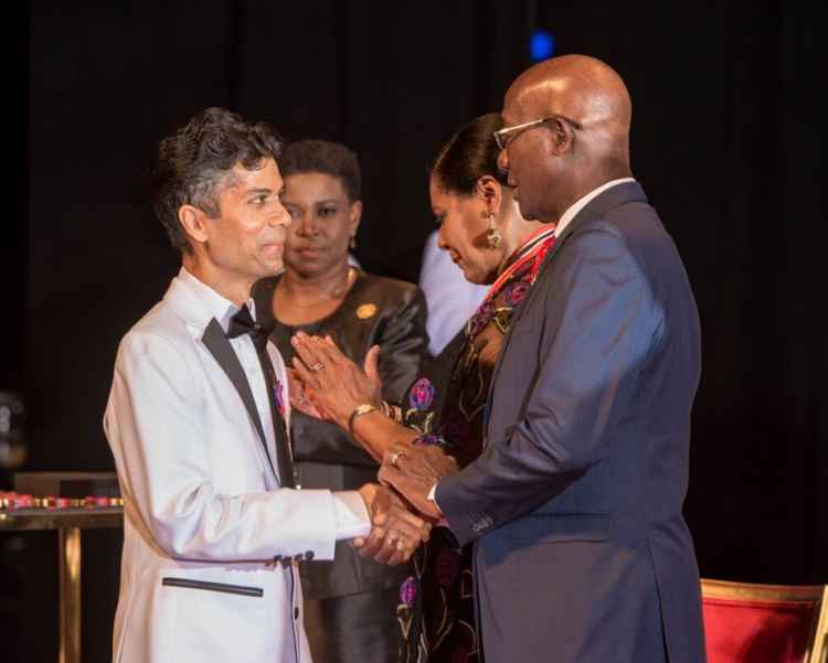 International Men's Day founder Dr Jerome Teelucksingh (l) with Trinidad and Tobago Prime Minister Dr Keith Rowley (Trinidad and Tobago Newsday)