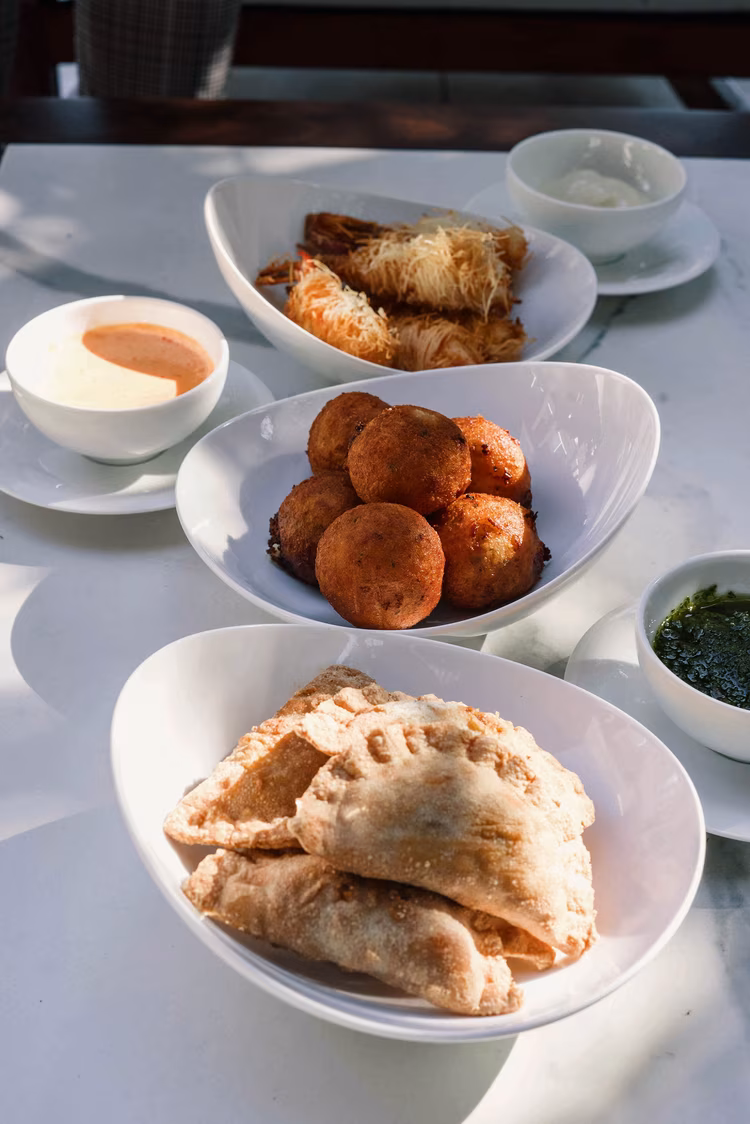 Encountering a vetkoek at a fine dining experience was surprisingly delightful, undoubtedly embodying the restaurant's ethos of elevating the African dining experience. (Image courtesy of The Saxon Hotel, Villas, Spa).