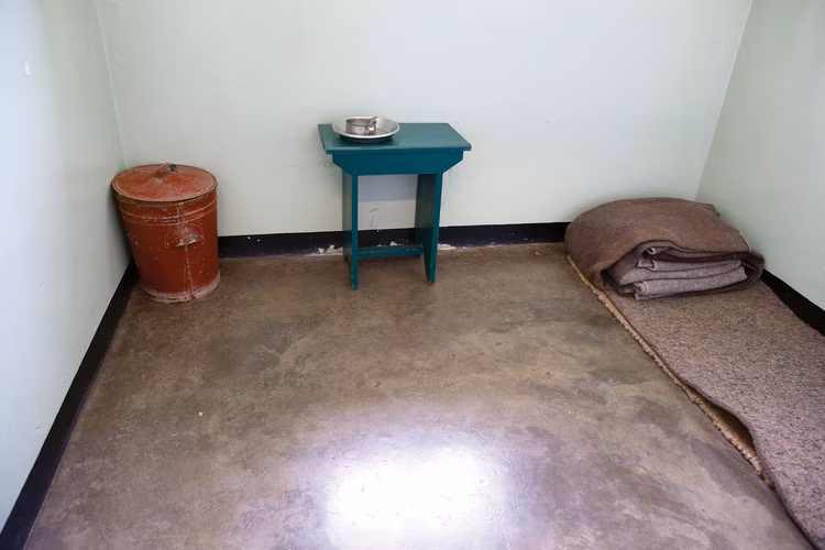 Once imprisoned, prisoners were forced to do hard labour extracting lime from the quarries and building the prisons and structures that would later hold them. (Image courtesy of Robben Island Museum).