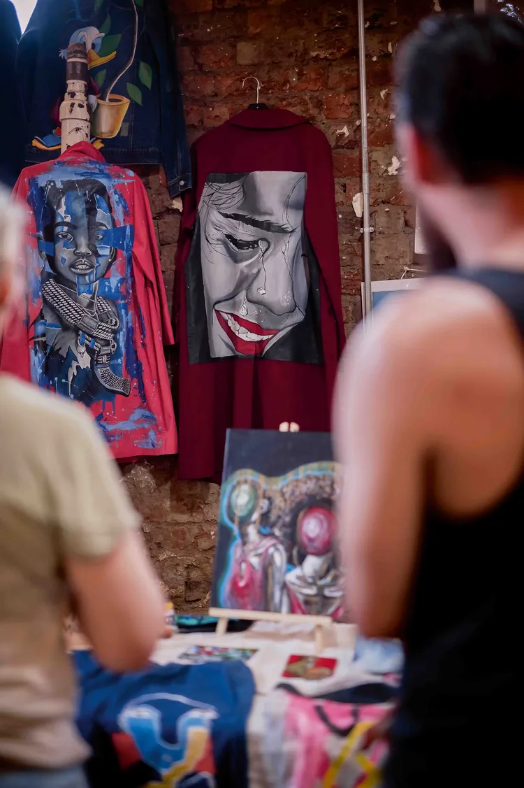 Visitors admiring painted jackets. Photo: Victoria Yards.