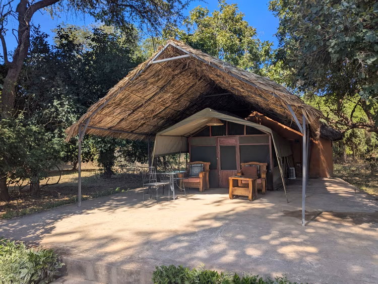 Croc Valley Camp offers riverfront camping, tented chalets, as well as individual rooms, and its breakfast area has the distinction of overlooking a river bursting with wildlife. (Image courtesy of Croc Valley Camp).
